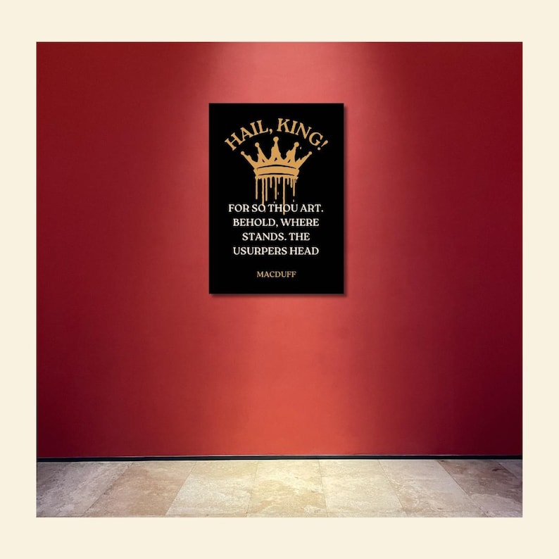 May include: A black rectangular wall art piece with gold text and a crown design. The text reads "HAIL, KING!" and a quote from Macduff. The artwork is displayed on a red wall.