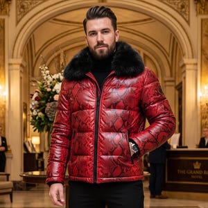 May include: A red puffer jacket with a black snakeskin pattern and a black fur collar. The jacket features a front zipper closure, long sleeves, and a high neck. It is worn over a black turtleneck sweater and paired with black trousers.