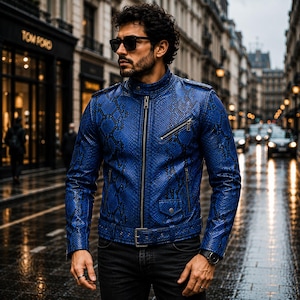 May include: A vibrant blue jacket featuring a textured snakeskin pattern, a stand-up collar, a full-length front zipper, and a buckled waist belt. The garment includes a diagonal zippered chest pocket and two lower zippered pockets with snap closures.