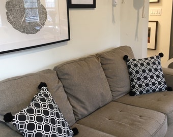 Modern bold graphic black and white throw pillows with handmade pompoms! Bring life to your space!