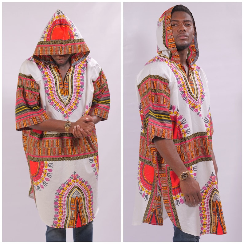 May include: A white hooded tunic with a colorful geometric pattern. The tunic has a long, flowing design and a hood with a drawstring. The pattern features orange, red, yellow, green, and purple colors.