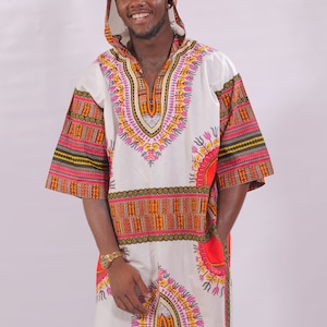 May include: A white hooded tunic with a colorful geometric pattern. The tunic has a V-neck and long sleeves. The pattern features orange, red, yellow, and pink colors.