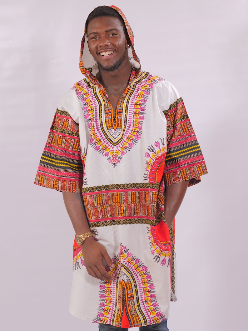 May include: A white hooded tunic with a colorful geometric pattern. The tunic has a V-neck and long sleeves. The pattern features orange, red, yellow, and pink colors.
