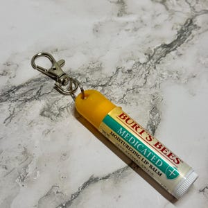 Accessorio per portachiavi, cordino e porta badge Burt's Bees.