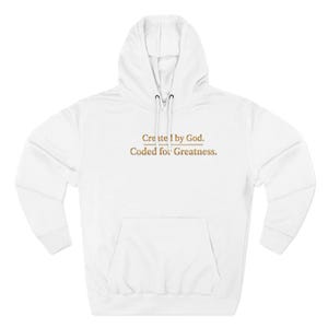 May include: White hooded sweatshirt with a front pocket and drawstring. The text "Create by God. Coded for Greatness." is printed in a gold color across the chest. The sweatshirt has long sleeves and a hood.