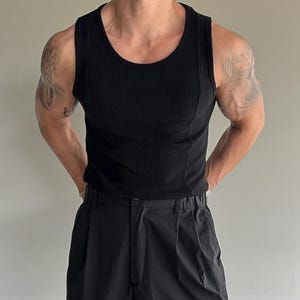 Men's Ribbed Tank Top | Slim Fit Muscle Vest | Casual Elastic Streetwear | Basic Training Shirt | Lightweight Gymwear
.
Men's ribbed sleeveless knit tank top with slim fit, designed for casual streetwear, gym, or summer layering in a minimalist fashion style.