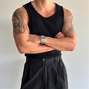 Men's Ribbed Tank Top | Slim Fit Muscle Vest | Casual Elastic Streetwear | Basic Training Shirt | Lightweight Gymwear
.
Men's ribbed sleeveless knit tank top with slim fit, designed for casual streetwear, gym, or summer layering in a minimalist fashion style.