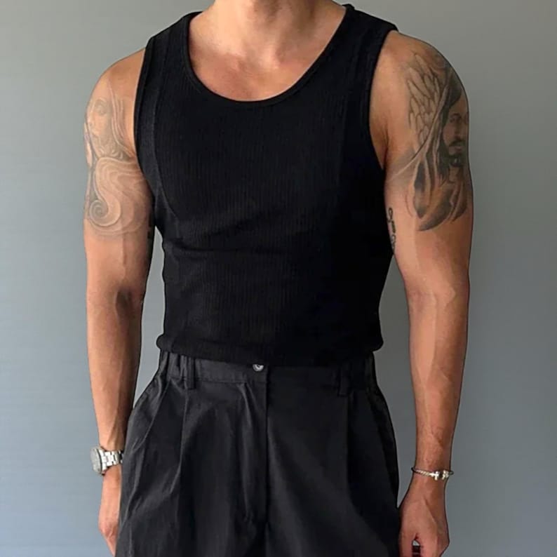 Men's Ribbed Tank Top | Slim Fit Muscle Vest | Casual Elastic Streetwear | Basic Training Shirt | Lightweight Gymwear
.
Men's ribbed sleeveless knit tank top with slim fit, designed for casual streetwear, gym, or summer layering in a minimalist fashion style.