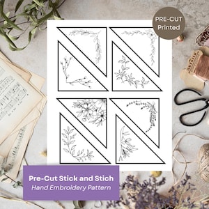 Könnte beinhalten: Ein weißes Blatt mit vier schwarz umrandeten Dreiecken, jedes mit einem anderen floralen oder botanischen Design. Der Text "Pre-Cut Stick and Stich Hand Embroidery Pattern" befindet sich unten, mit "PRE-CUT Printed" in einem Kreis oben.