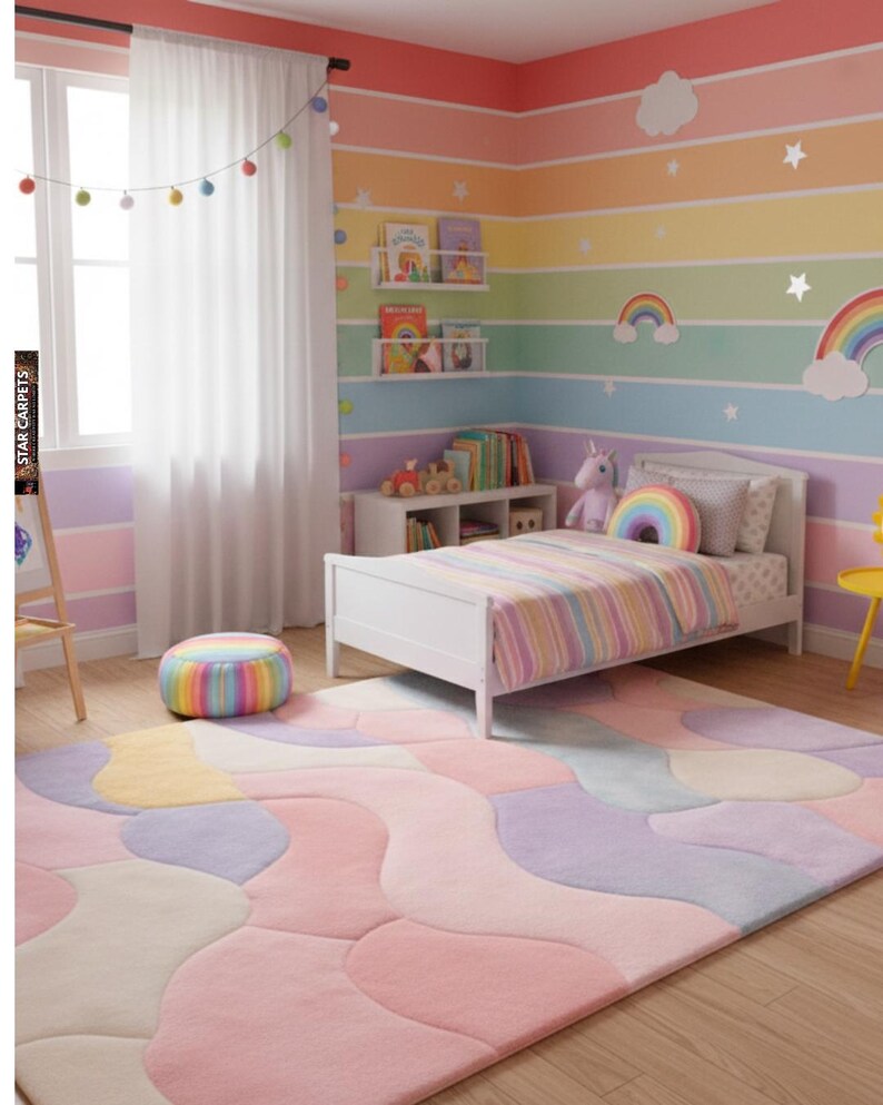 May include: A children's bedroom decorated in a rainbow theme. The room has a white bed with a striped duvet, a patterned rug, and walls painted in rainbow stripes. Decorative items include a rainbow cushion, clouds, and stars.