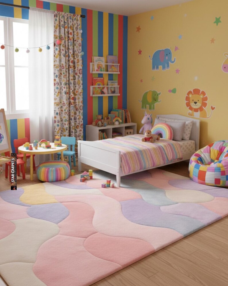 May include: A colorful children's bedroom with a pastel-colored rug, a white bed with a striped comforter, and a beanbag chair. The walls are decorated with animal decals and rainbow-themed decor. A small table and chairs are in the foreground.
