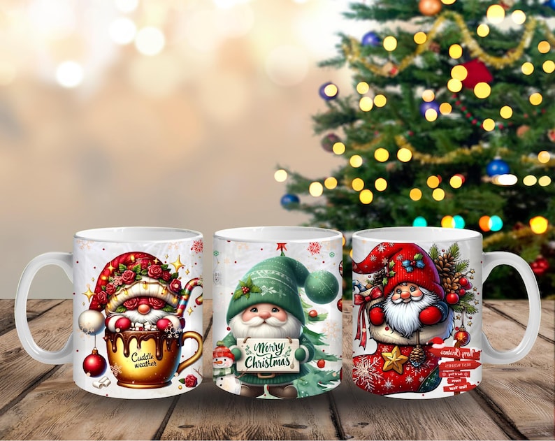 May include: Three white ceramic mugs with Christmas gnome designs. One mug features a gnome in a red hat, another in a green hat holding a sign that says "Merry Christmas", and the third in a red hat in a stocking. The mugs are on a wooden surface.