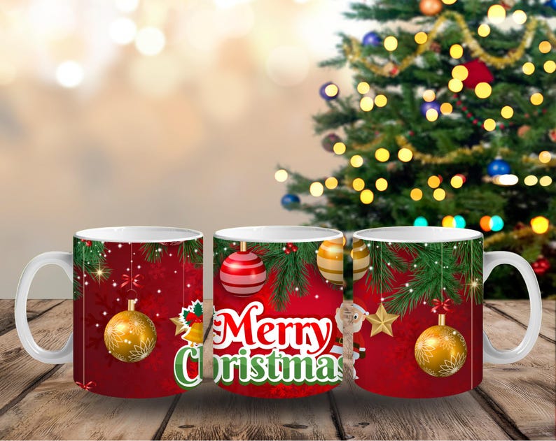 May include: White ceramic Christmas mug with a red background and festive decorations. The mug features gold and red ornaments, green pine branches, and the words "Merry Christmas" in white and green.