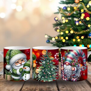 May include: Three white ceramic Christmas mugs with festive designs. One mug features Santa Claus with a snowman, another a Christmas tree, and the third a gnome with a candy cane. The mugs are set against a blurred background of a Christmas tree.