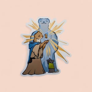May include: A sticker featuring an illustration of a blue bear-like figure with a golden aura, a weasel in a robe, and a mouse in a green shirt. The weasel is holding a small object. The sticker has a white border and a pink background.