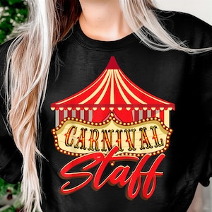 May include: Black sweatshirt with a red and yellow circus tent graphic and the words "CARNIVAL Staff" in red and yellow. The design includes a marquee-style sign with illuminated bulbs, perfect for carnival staff.