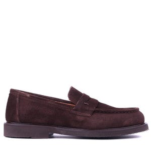 May include: A single brown suede loafer with a penny strap. The shoe has a rounded toe and a thick, dark brown sole. The shoe is designed for comfort and style.