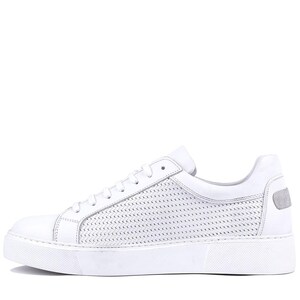 May include: White leather sneakers with a low-top design. The shoe features a perforated pattern on the side and a solid white sole. A small, gray accent is on the heel.
