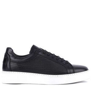 May include: Black leather sneaker with a white sole. The shoe features a woven texture on the side panel and a smooth leather upper. The laces are black, and the sole is approximately 1 inch thick.