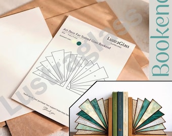 May include: Art Deco fan stained glass bookends with a wooden base. The bookends feature a fan design with shades of green, white, and gold. The image also shows a diagram and the text "LustraGlass". The bookends are 9 inches in height.