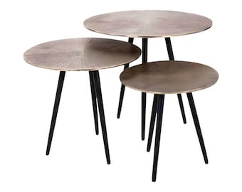 May include: A set of three round nesting tables. The bronze-finished tabletops feature a radial design. Each table has black, tapered legs. The tables are different sizes, designed to nest together. The largest table is approximately 60 cm in diameter.