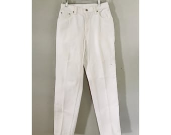 May include: White denim jeans with a high waist and a straight leg.
