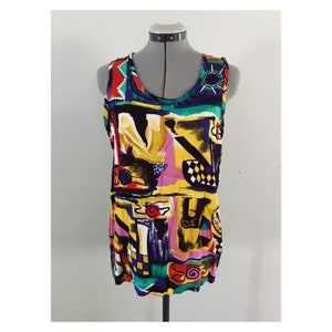 May include: A sleeveless tank top with a colorful abstract print featuring geometric shapes, lines, and swirls in shades of yellow, pink, blue, green, red, and black.