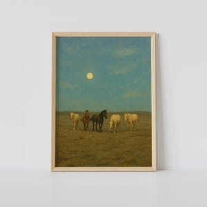 May include: A framed art print featuring a serene landscape with five horses in a field under a blue sky with a full moon. The horses vary in color from light tan to dark brown.