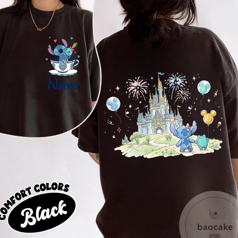 May include: Black Comfort Colors t-shirt featuring a cartoon Stitch design. The front shows Stitch in a teacup, the back has Stitch, a frog, and a castle with fireworks. The shirt has the word "Name" on the front.