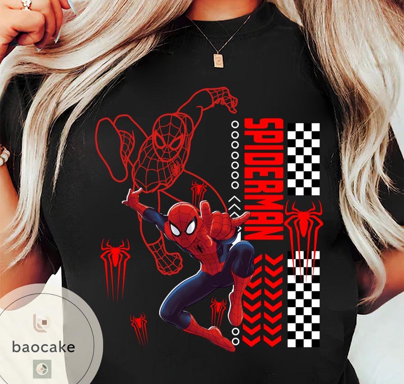 May include: Black t-shirt featuring a vibrant Spider-Man graphic. The design includes a dynamic illustration of Spider-Man in action, the word "SPIDERMAN" in red, and a checkered pattern. Red spider symbols are also present.