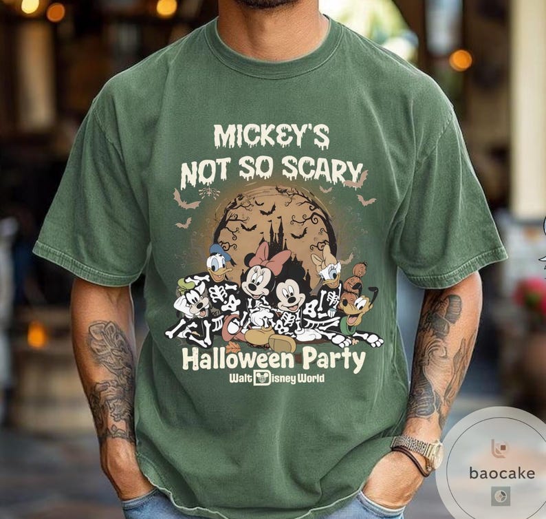May include: Green t-shirt with the text "Mickey's Not So Scary Halloween Party" and a graphic of Disney characters in skeleton costumes. The graphic includes Mickey, Minnie, Donald, and Goofy in front of a full moon. Bats are flying around the moon.