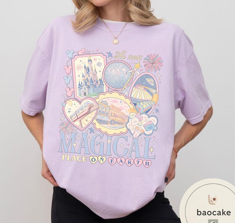 May include: A lilac t-shirt with a vibrant graphic that reads "MAGICAL PLACE ON EARTH". The design incorporates illustrations of a castle, a globe, a monorail, and other theme park features. The shirt has short sleeves.