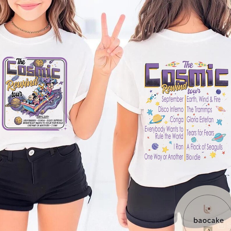 May include: White t-shirts with a graphic design. The front of the shirt features the text "The Cosmic Rewind tour" with a cartoon image. The back of the shirt lists the tour's setlist, including "September, Earth, Wind & Fire, Disco Inferno".