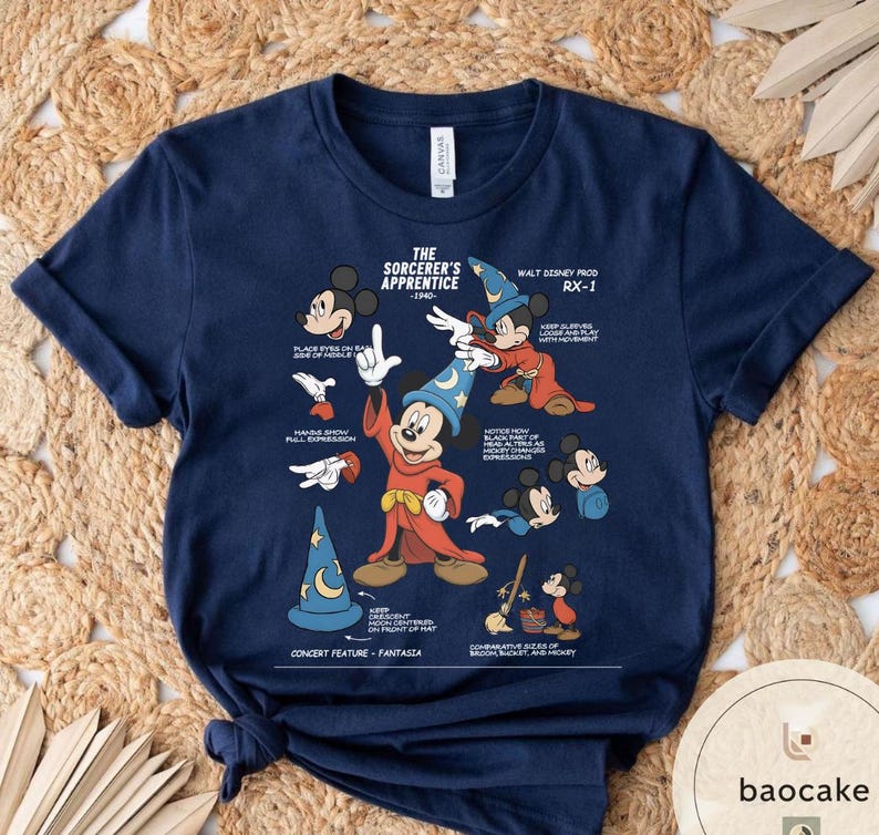 May include: Navy blue t-shirt featuring a graphic of Mickey Mouse as the Sorcerer's Apprentice from Fantasia. The design includes various poses and details from the film, with text that reads "The Sorcerer's Apprentice - 1940" and "Walt Disney Prod RX-1".