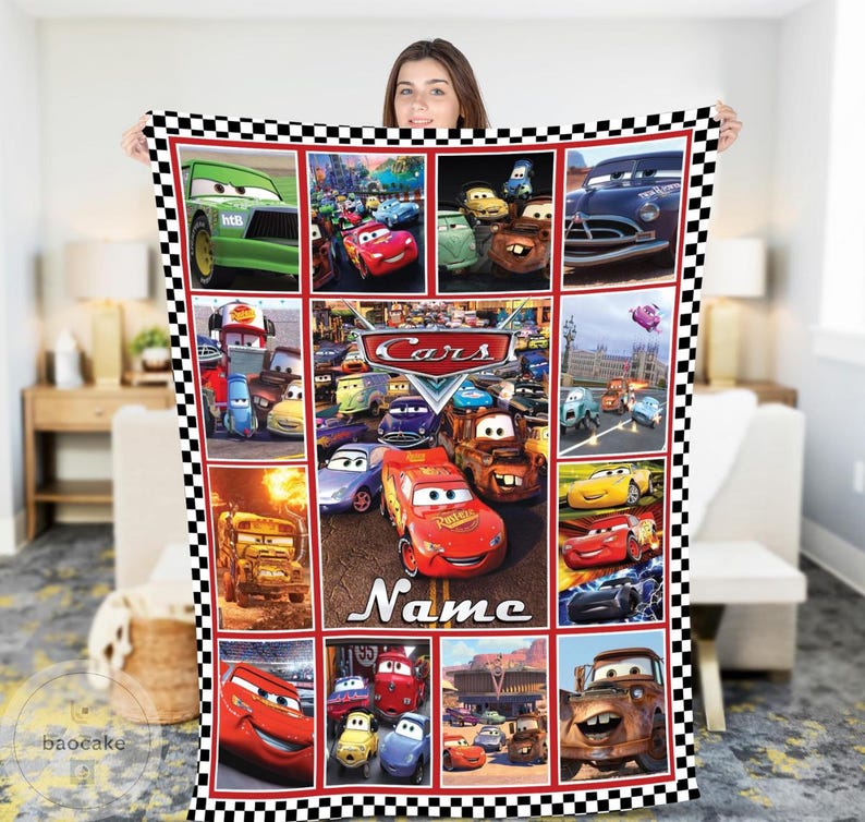 May include: A rectangular fleece blanket featuring a collage of various characters from the Disney Pixar movie Cars, including Lightning McQueen and Mater. The blanket has a black and white checkered border and the word Name printed at the bottom.