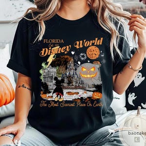 May include: Black t-shirt featuring a Halloween-themed graphic with the text "Florida Disney World Est. 1971." The design includes a jack-o'-lantern, Mickey Mouse, and a castle. The phrase "The Most Scariest Place On Earth" is also printed on the shirt.