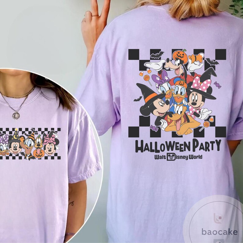 May include: A light purple t-shirt featuring a Halloween-themed graphic. The design includes cartoon characters in Halloween costumes, with the words "Halloween Party" and "Walt Disney World" printed below the characters.