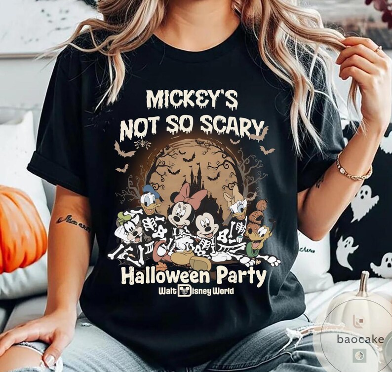 May include: Black t-shirt featuring a Halloween design with Mickey Mouse, Minnie Mouse, Donald Duck, and Goofy in skeleton costumes. The shirt includes the text "Mickey's Not So Scary Halloween Party" and the Walt Disney World logo.