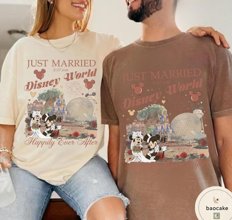 May include: Two t-shirts, one cream and one brown, featuring a Disney World design. The design includes the text "Just Married" and "Happily Ever After", along with images of Mickey and Minnie Mouse in wedding attire, and Disney landmarks.