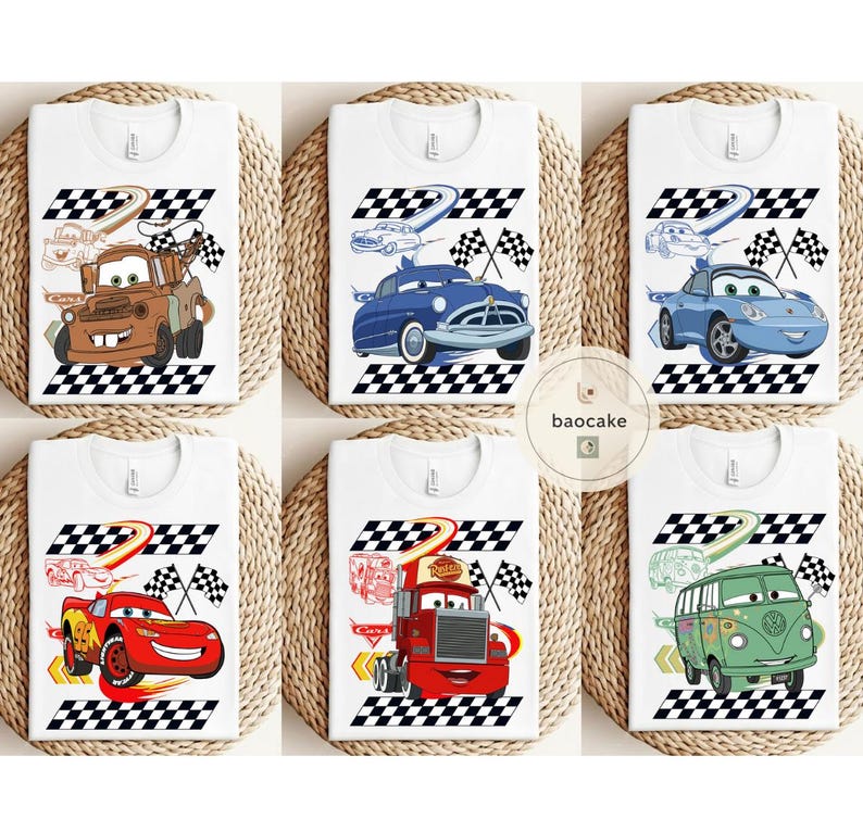 May include: White t-shirts featuring cartoon car designs. Each shirt showcases a different car character with a checkered flag and racing track graphic. The designs include a brown tow truck, a blue classic car, and a red race car.