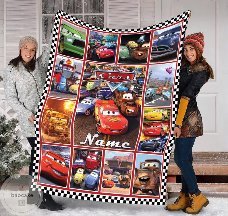 May include: A rectangular fleece blanket featuring a collage of scenes from the Disney Pixar movie Cars, including Lightning McQueen and Mater. The blanket has a black and white checkered border and the word Name printed in white script.