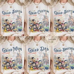 May include: Cream-coloured t-shirts with graduation designs. Each shirt features a Disney-themed graphic with characters like Mickey Mouse and Donald Duck, along with text such as "Grad Squad" and "Class of 2026".
