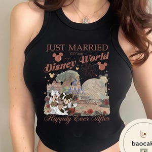 May include: Black tank top with a Disney World graphic. The design includes the text "Just Married Disney World Est 2026" and a graphic of Mickey and Minnie Mouse in wedding attire. The phrase "Happily Ever After" is also featured.