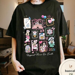 May include: Black t-shirt featuring a colorful collage of Disney characters in nurse attire, including Mickey and Minnie Mouse, Donald Duck, and Goofy. The design includes a castle, hearts, and the text "Happiest Nurse On Earth" and "2026".