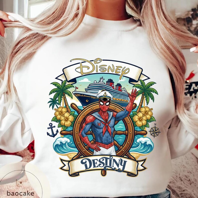 May include: White sweatshirt featuring a graphic of Spider-Man in a sailor outfit at the helm of a ship. The design includes the words "Disney" and "Destiny", palm trees, and a cruise ship.