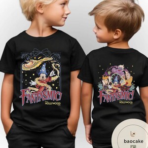 May include: Black t-shirts featuring a colorful Fantasmic! design with Mickey Mouse as a sorcerer. The front of the shirt has Mickey with a magic wand. The back of the shirt has a group of Disney characters.