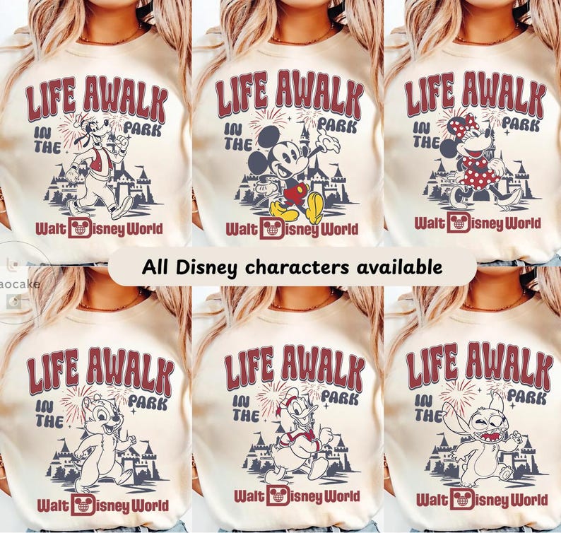 May include: Cream-colored sweatshirts with various Disney character graphics. Each shirt features the text "LIFE AWALK IN THE PARK" in burgundy, along with "Walt Disney World." The image also states "All Disney characters available."