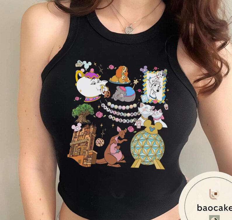 May include: Black tank top featuring a colorful cartoon collage. The design includes images of animated characters, a teapot, a tree, a kangaroo, and a decorative ball. The tank top is sleeveless and has a round neckline.