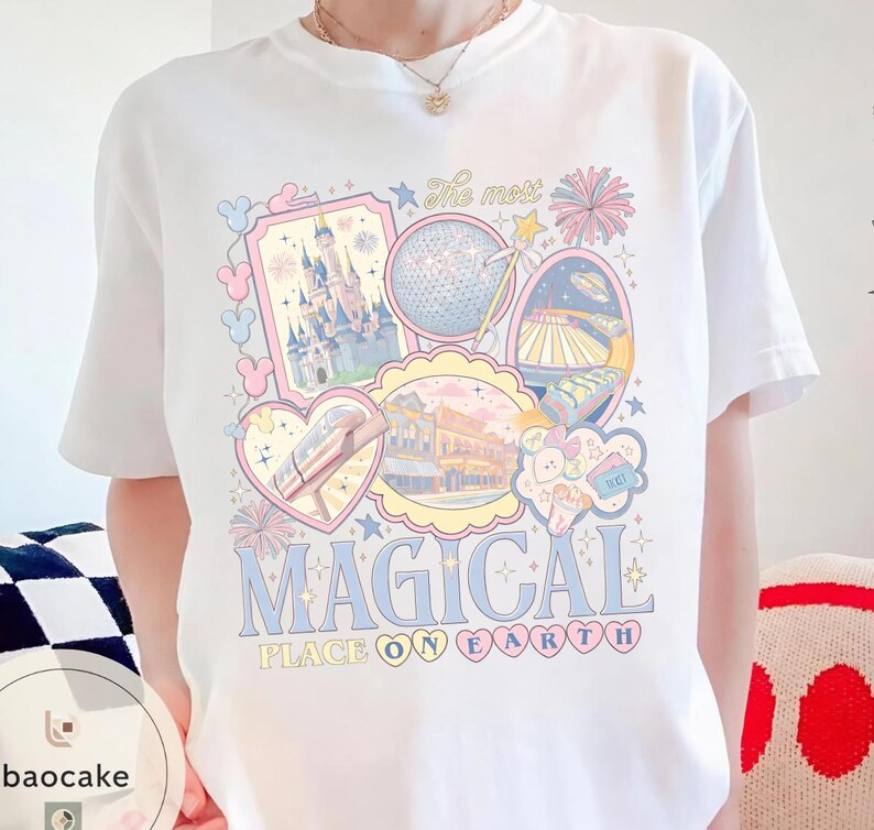 May include: White t-shirt with a colourful graphic featuring theme park icons, including a castle, a sphere, and a monorail. The text "The most MAGICAL PLACE ON EARTH" is displayed in a playful font.