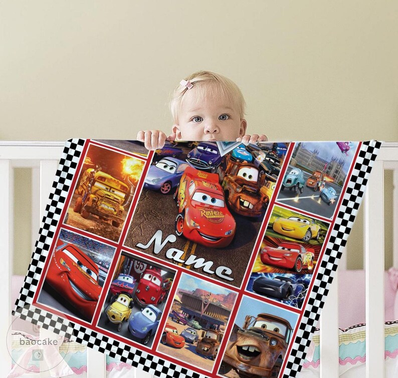 May include: A rectangular blanket featuring a collage of various animated car characters from the movie Cars, including a prominent red race car in the center. The design includes a black and white checkered border and the word Name in white script.